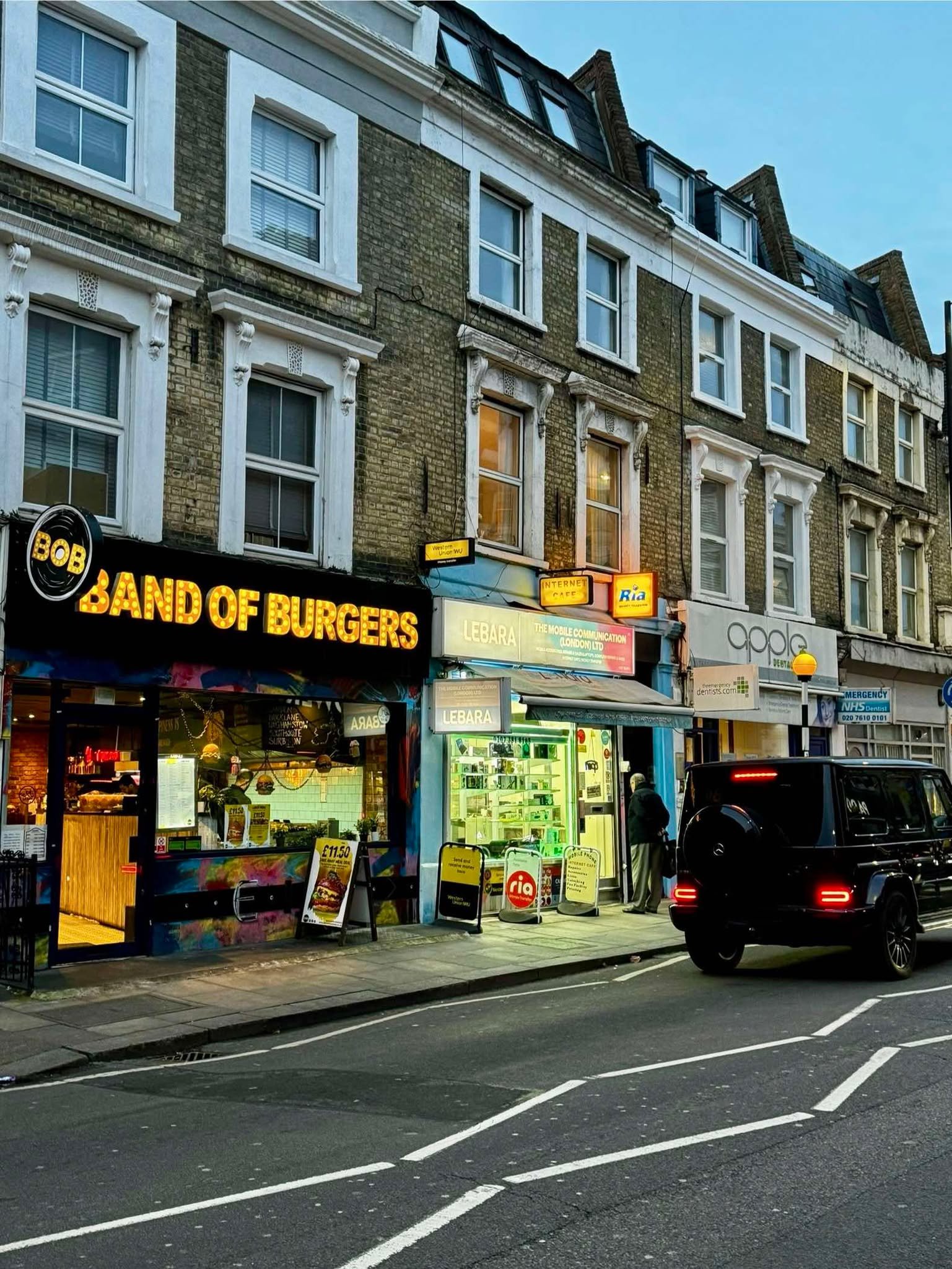 Band of Burgers Fulham's vibrant storefront with illuminated signage and street art - home of London's finest halal gourmet burgers, near Fulham Broadway