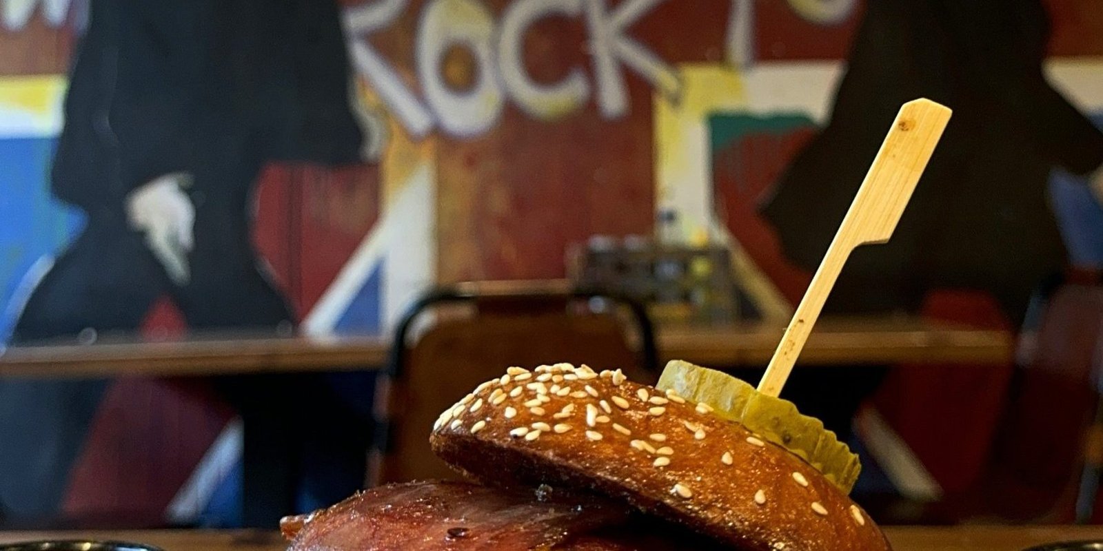 lvis Burger with double Angus beef patties, American cheese, turkey bacon, and truffle honey glaze at Band of Burgers restaurant in London